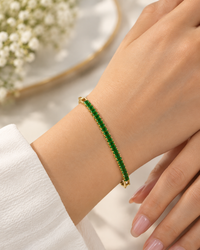 Emerald Cascade Gold Tennis Bracelet